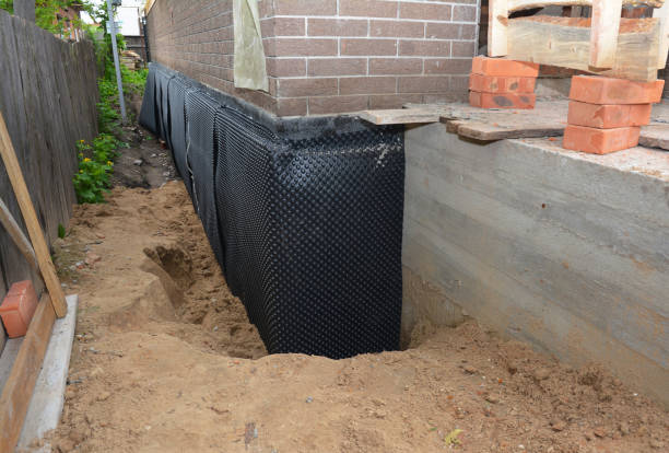 Happy homeowners after waterproofing job in Atlantic Beach